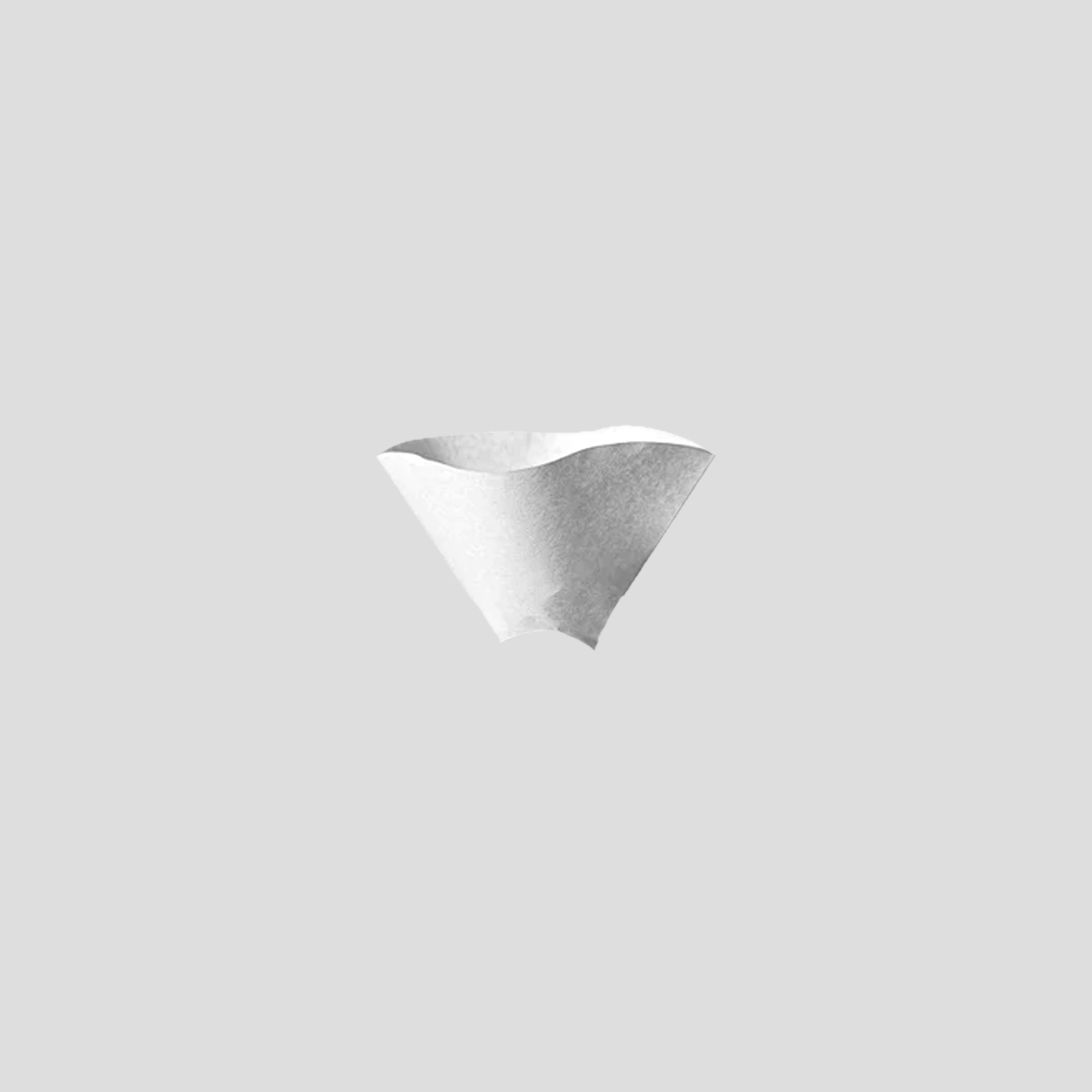 White paper coffee filter in the shape of a cone, on a light gray background.