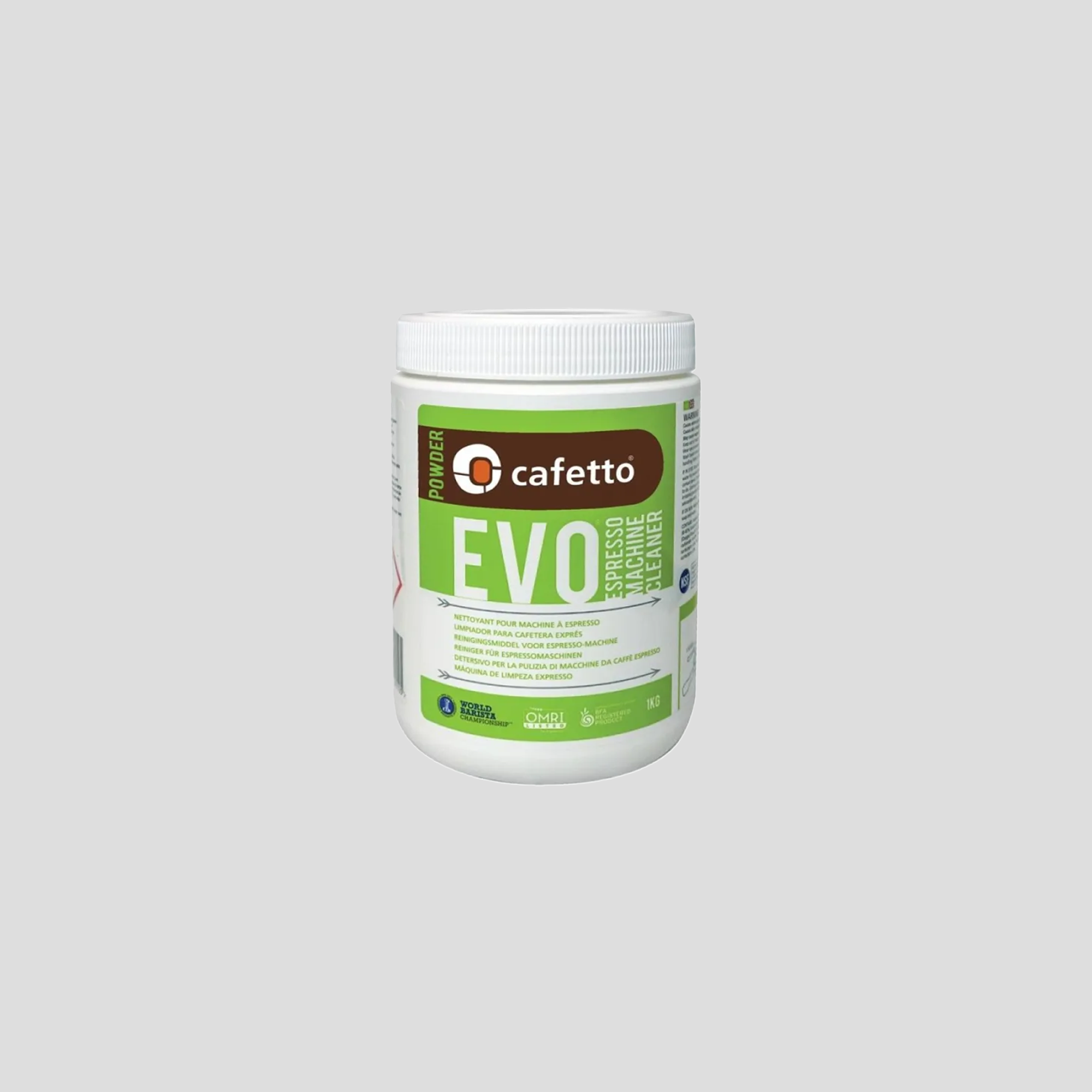 Envase de polvo limpiador Cafetto EVO para máquinas de espresso. El recipiente blanco con etiqueta verde y marrón contiene instrucciones en varios idiomas. Es un producto ecológico diseñado para la limpieza eficaz de máquinas de café profesionales.